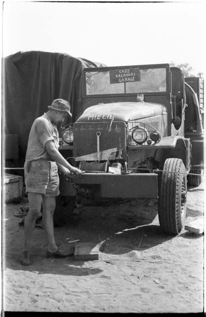 Casper Kruger working on the front of one of the expedition GMC trucks