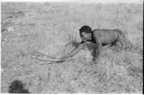 "Crooked /Qui" crawling, holding bow and arrow