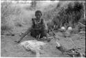 Portrait of "Old Xama," mother of "Gao Beard," sitting beside her fire