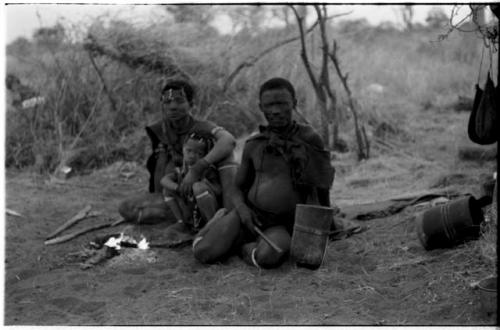 ≠Gao (Headman of Band 3; son of /Gasa) with his unidentified wife and child, all seated