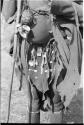 Close-up of tortoise shell ornaments and apron decorated with hanging ornaments worn by !Ghia (second wife of "Old ≠Gao" from Band 10)