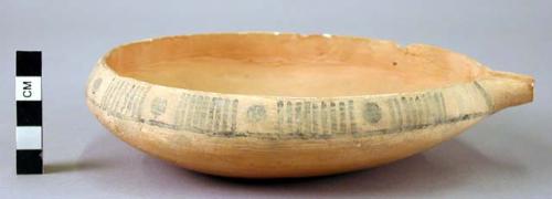 Rim of flat spouted pottery bowl