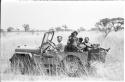 Daniel Blitz driving a Jeep with a group of Ju/'hoansi