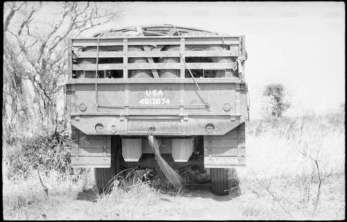 Back of the GMC truck with wildebeest tail hanging from it