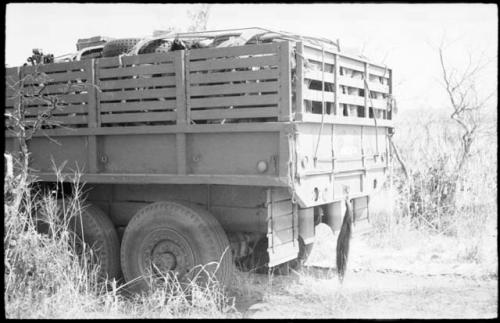 Back of the GMC truck with wildebeest tail hanging from it