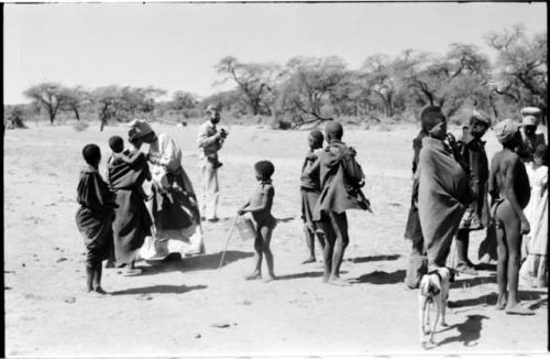 Group of people standing, including Daniel Blitz holding a camera