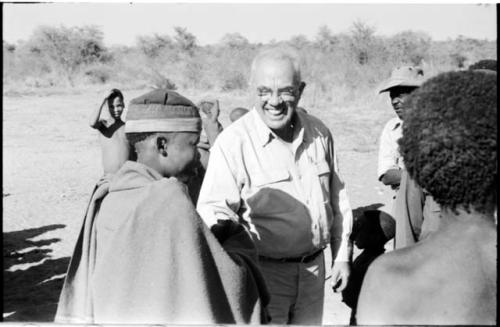 /Gishay, son of "Old Gau," standing with Laurence Marshall