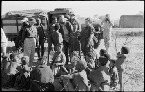 Group of people standing and sitting with expedition staff