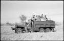 Group of people riding in the expedition GMC truck with William Donnellan driving