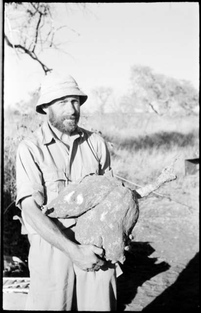 Robert Story holding a plant specimen, a large storage organ