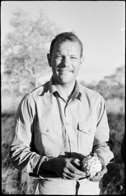 William Donnellan holding a cucumber, portrait