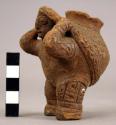 Aguas Buenas (Canas Gordas) effigy: female carrying jar.  Incised front and rear