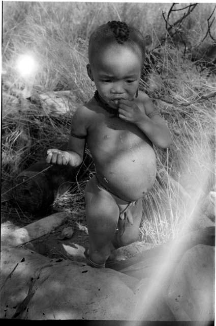 N!whakwe eating a cucumber