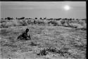 /Twikwe clearing ground with a digging stick, distant view