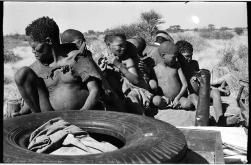 Oukwane, /Twikwe, Tsekue, and four others on top of expedition truck