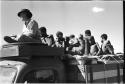 Oukwane, /Twikwe, Tsekue, N!whakwe, Lorna Marshall, and four others on top of the expedition truck