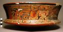 Wooden model of large pottery dish with painted design (serpent)
