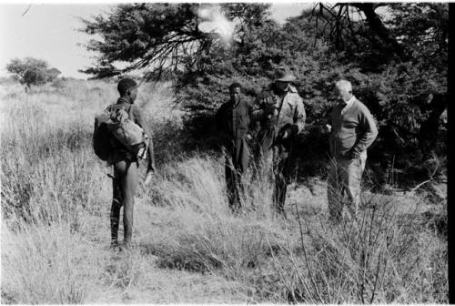 !Gai, Laurence Marshall, Casper Kruger, and Dabe standing in a field