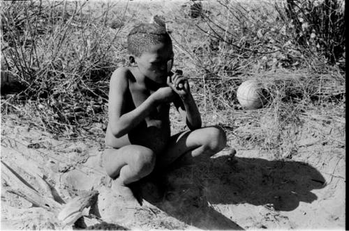 /Gaiamakwe taking a bite of meat, cutting it off at his lips