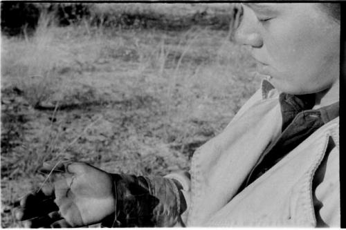 Elizabeth Marshall Thomas holding a mantis in her hand