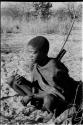 !Gai crouching in sand, quiver and bow over his shoulder