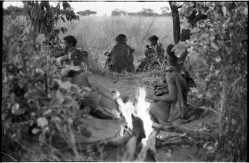 Visitors' fire with a group of people in the background