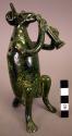 Ceramic mottled green, glazed animal musician figurine. One of four