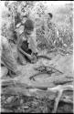 Boy from "visiting group" starting a fire