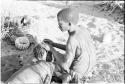 !Gai seated, cutting another man's hair