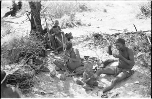 !Gai's family eating tsama melons (Back to front, left to right: //Ku≠tera, /Twikwe, Taekue, N!whakwe, and !Gai)