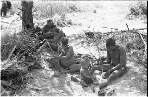 !Gai's family eating tsama melons (Back to front, left to right: //Ku≠tera, /Twikwe, Taekue, N!whakwe, and !Gai)