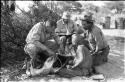 William Donnellan asking Oukwane to name the parts of an animal, with Robert Story and Wilhelm Camm present
