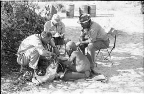 William Donnellan asking Oukwane to name the parts of an animal, with Robert Story and Wilhelm Camm present