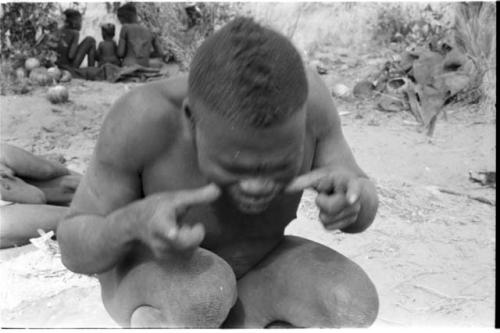 Visiting man demonstrating hunting hand signals