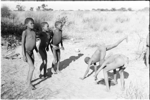 Boys from Oukwane's group and "visiting group" playing an ostrich game