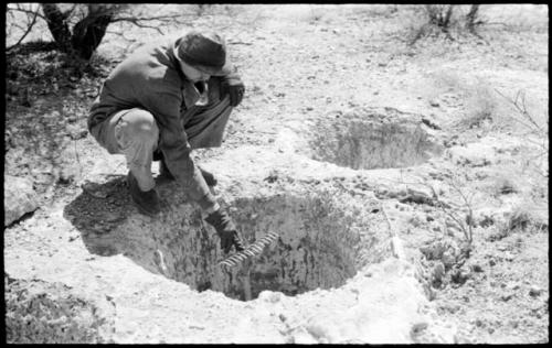 Casper Kruger showing the depth of a pit near the Herero Reservation