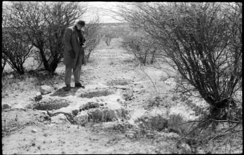 Casper Kruger standing next to pits near the Herero Reservation