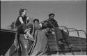 Philip Hameva, Heinrich Neumann and Elizabeth Marshall Thomas sitting on the top of an expedition truck