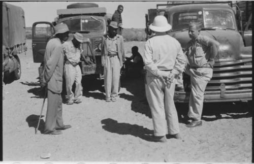 Group of people standing with Theunis Berger and Laurence Marshall