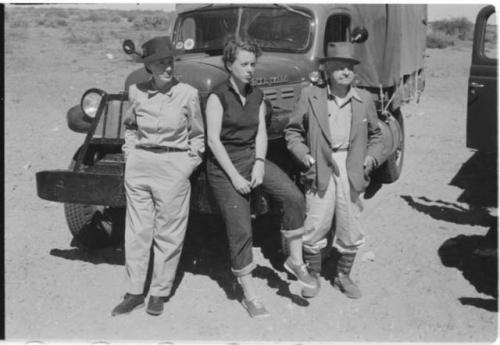 Lorna Marshall, Elizabeth Thomas Marshall, and L. F. Maingard standing next to an expedition truck