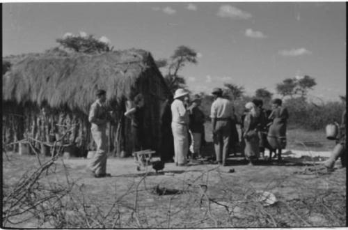 Group of people talking with L. F. Maingard