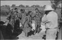 Group of people talking with L. F. Maingard, with Laurence Marshall photographing them