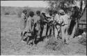 Group of people receiving tobacco from Lorna Marshall