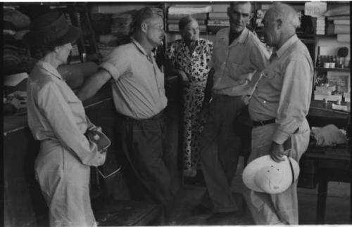 Group of people in conversation, including Lorna Marshall, Laurence Marshall and Theunis Berger