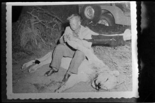 Theunis Berger with dead lion (copy of Polaroid photograph)