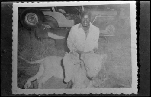 Simon Molamo with dead lion (copy of Polaroid photograph)