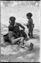 Di!ai nursing /Gaishay and her younger son, Debe, standing behind her