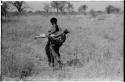 Woman carrying meat in a kaross