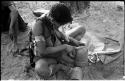 Woman trimming the edge of a leather headband with a knife