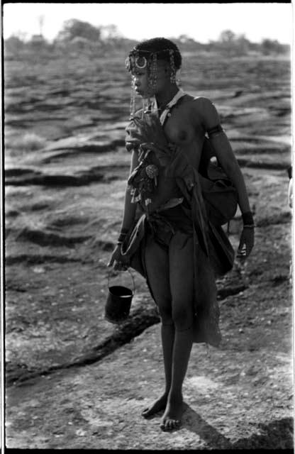 !Ungka's cousin carrying a tin of water